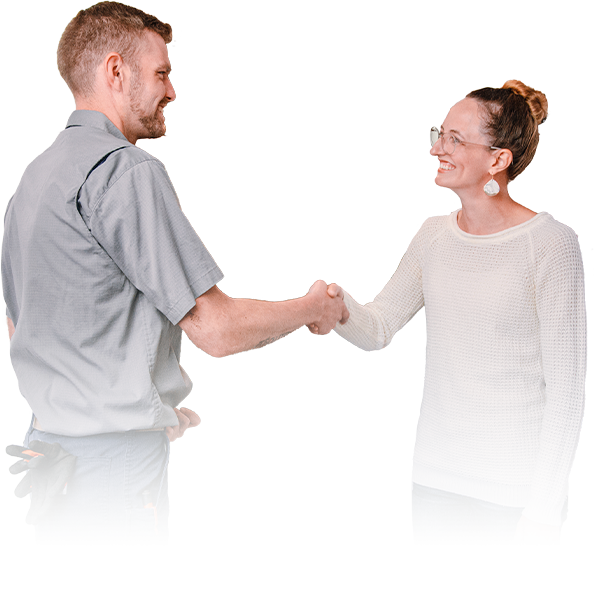 Technician in a gray uniform shaking hands with a smiling homeowner in Graham, WA.